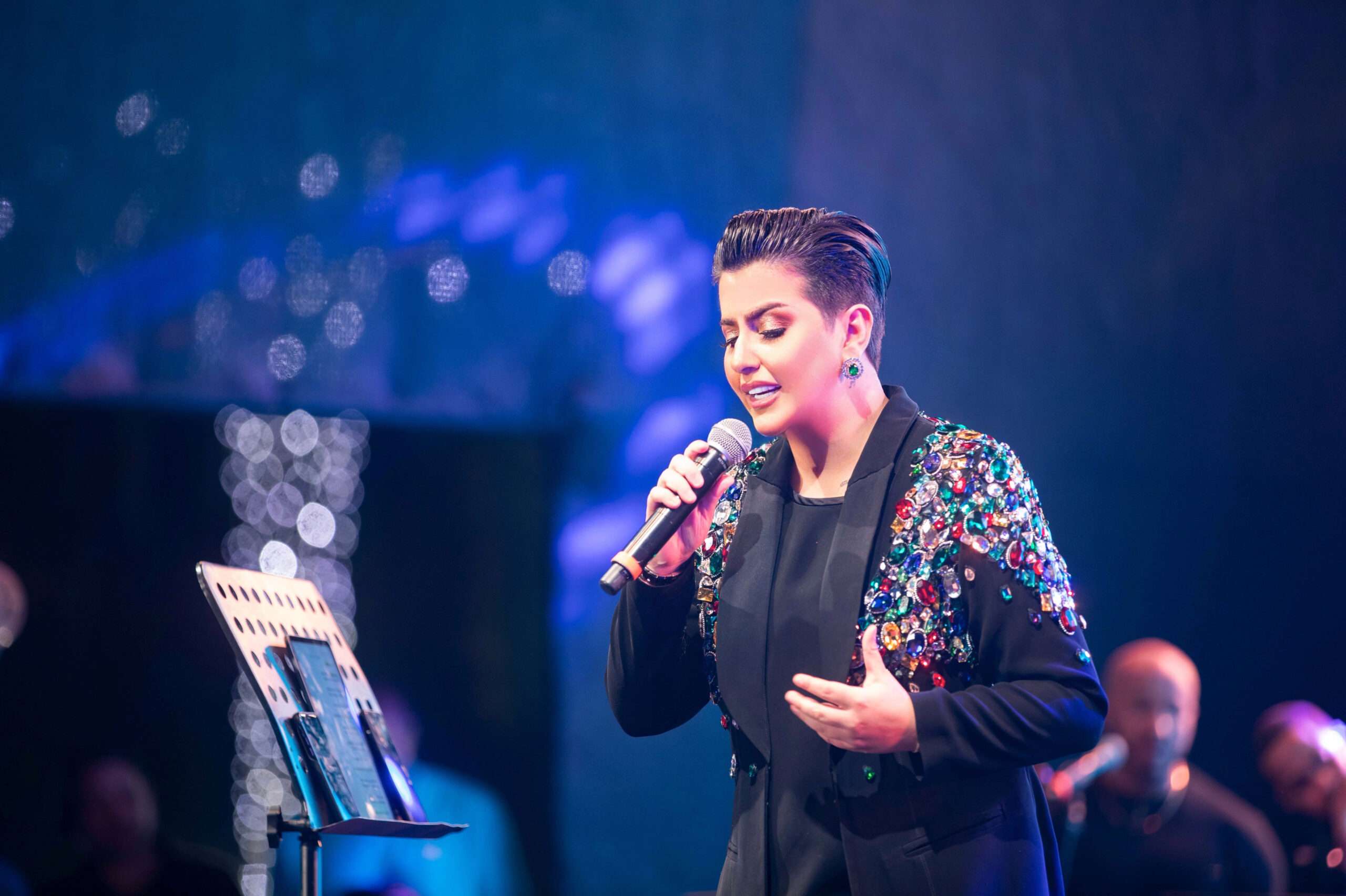 Image of a female singer performing on stage